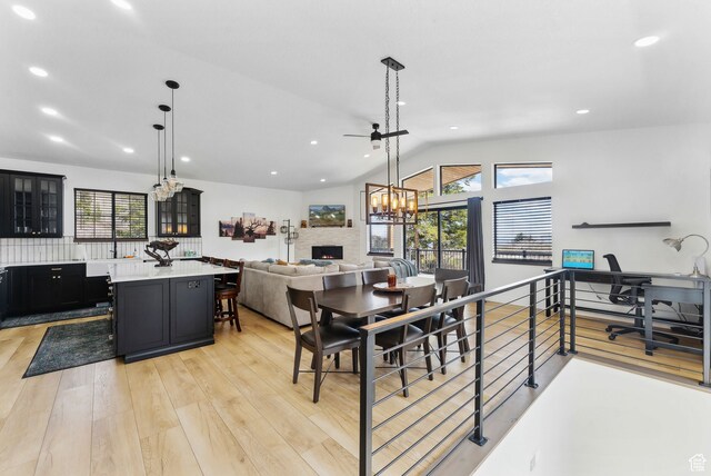 1430 W Arapaho Dr Unit 59, Coalville, UT 84017 - dining area featuring lofted ceiling and light hardwood / wood-style flooring