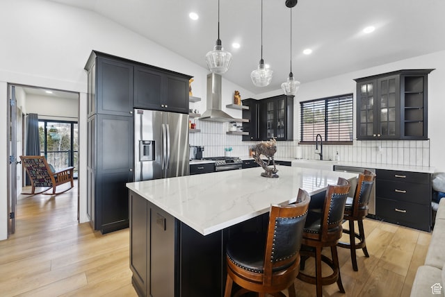 1430 W Arapaho Dr Unit 59, Coalville, UT 84017 - kitchen with sink, appliances with stainless steel finishes, hanging light fixtures, a center island, and island range hood