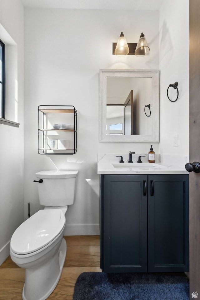 1430 W Arapaho Dr Unit 59, Coalville, UT 84017 - bathroom featuring vanity, hardwood / wood-style floors, and toilet