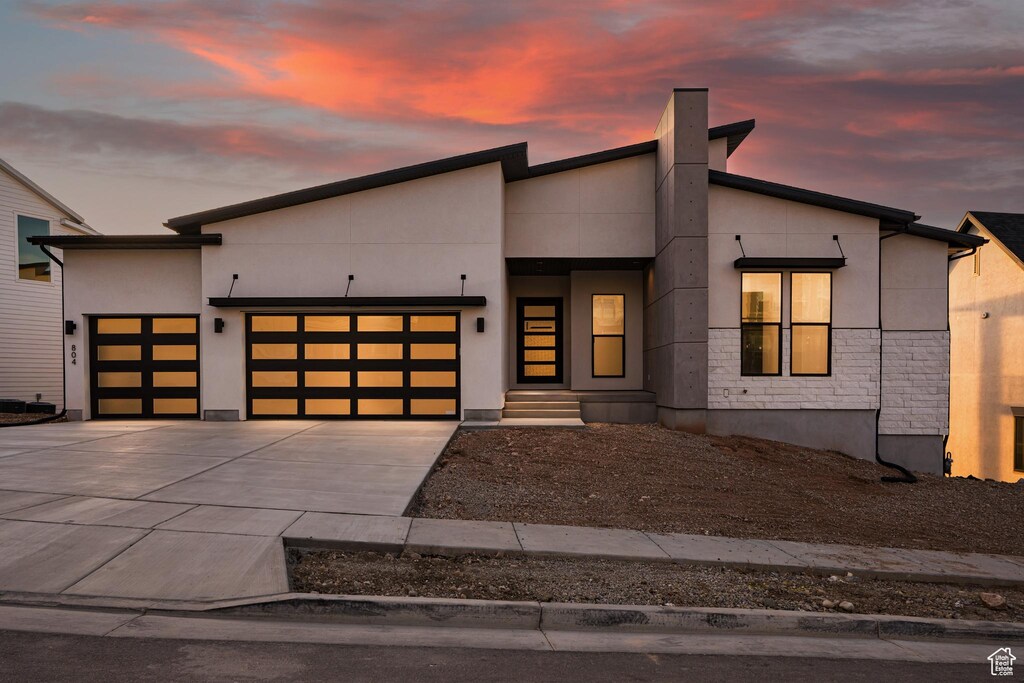 804 S Finley Cir Unit 243, North Salt Lake, UT 84054 - contemporary house with driveway, a garage, and stucco siding