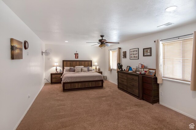 4623 Pueblo Verde Dr, Moab, UT 84532 - bedroom with ceiling fan, light carpet, and multiple windows