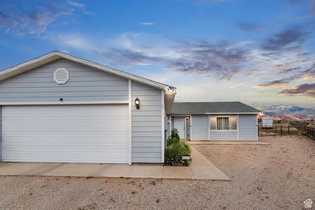 4623 Pueblo Verde Dr, Moab, UT 84532 - ranch-style house featuring a mountain view and a garage