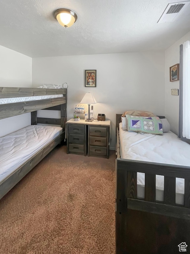 4623 Pueblo Verde Dr, Moab, UT 84532 - carpeted bedroom with a textured ceiling