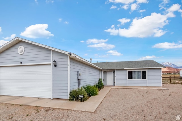 4623 Pueblo Verde Dr, Moab, UT 84532 - ranch-style home featuring a mountain view and a garage