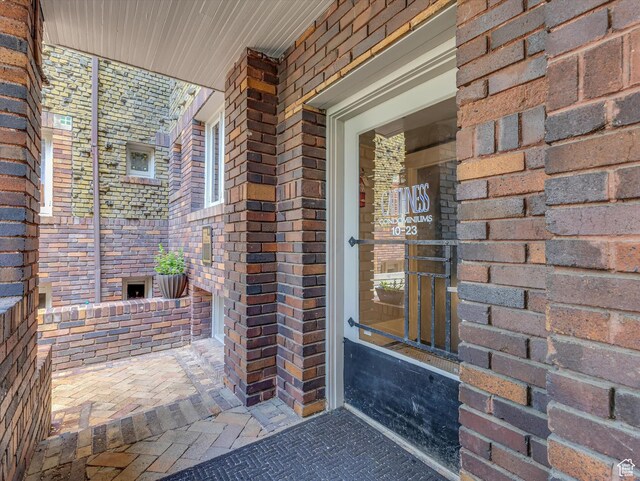 86 B St E Unit 10, Salt Lake City, UT 84103 - doorway to property featuring brick siding