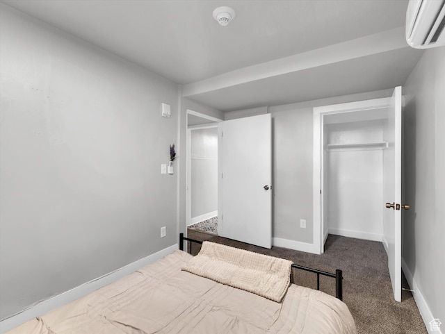 86 B St E Unit 10, Salt Lake City, UT 84103 - bedroom with a wall mounted AC, a closet, and carpet