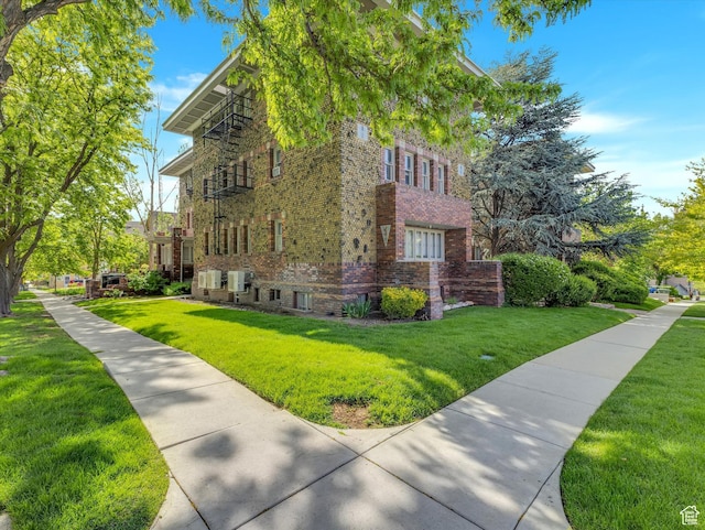 86 B St E Unit 10, Salt Lake City, UT 84103 - view of property exterior with a lawn