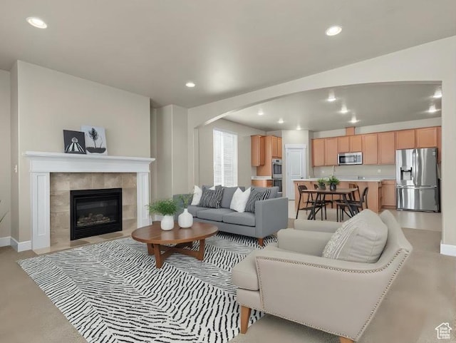 93 E 425 N, Vineyard, UT 84059 - living area featuring arched walkways, recessed lighting, a fireplace, and baseboards