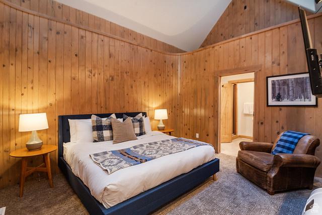 3009 E Black Forest Rd, Sundance, UT 84604 - carpeted bedroom featuring high vaulted ceiling and wood walls