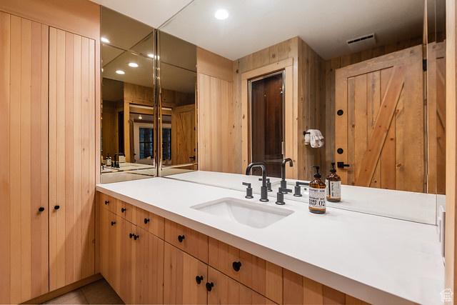 3009 E Black Forest Rd, Sundance, UT 84604 - bathroom featuring vanity and wooden walls