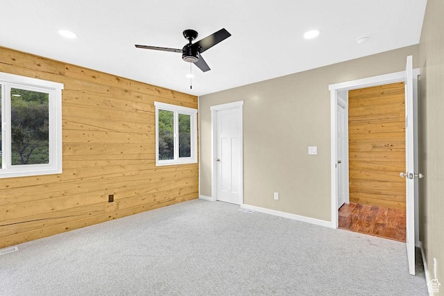999 Cisco Run, Garden City, UT 84028 - unfurnished bedroom featuring carpet floors, wood walls, baseboards, recessed lighting, and ceiling fan