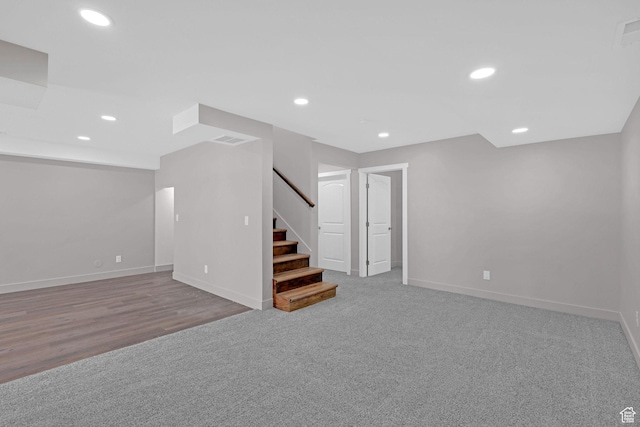 999 Cisco Run, Garden City, UT 84028 - below grade area featuring stairway, baseboards, recessed lighting, carpet, and wood finished floors