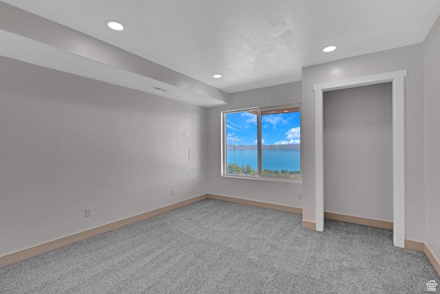 999 Cisco Run, Garden City, UT 84028 - unfurnished bedroom featuring light colored carpet, baseboards, and recessed lighting