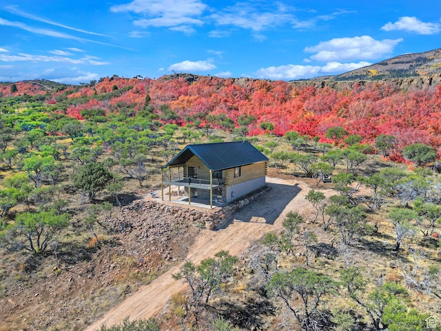 999 Cisco Run, Garden City, UT 84028 - aerial view of property and surrounding area featuring a heavily wooded area and mountains