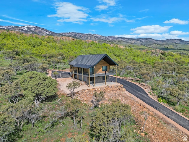999 Cisco Run, Garden City, UT 84028 - aerial view of property and surrounding area featuring a mountainous background and a heavily wooded area
