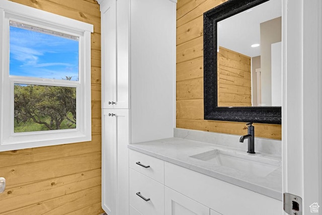 999 Cisco Run, Garden City, UT 84028 - bathroom featuring wood walls and vanity