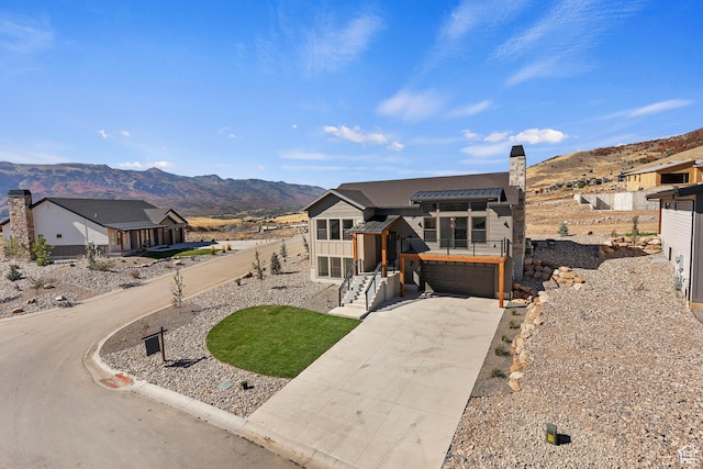 4778 Paddleford Dr Unit 227, Eden, UT 84310 - view of front of property featuring driveway, a mountain view, a garage, and fence