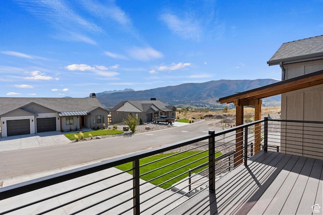 4778 Paddleford Dr Unit 227, Eden, UT 84310 - wooden terrace featuring a residential view, driveway, an attached garage, and a mountain view