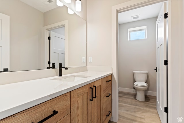 4778 Paddleford Dr Unit 227, Eden, UT 84310 - bathroom with wood finished floors, vanity, toilet, and baseboards