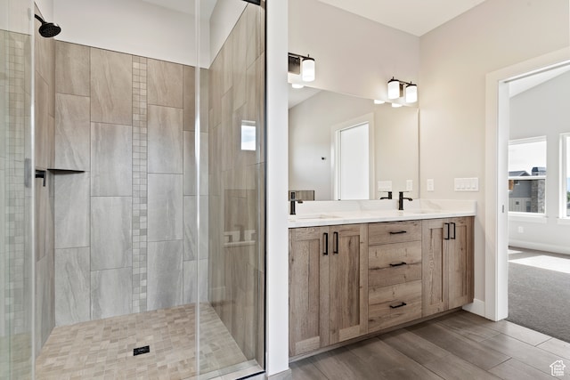 4778 Paddleford Dr Unit 227, Eden, UT 84310 - bathroom with a stall shower, wood finished floors, double vanity, and baseboards