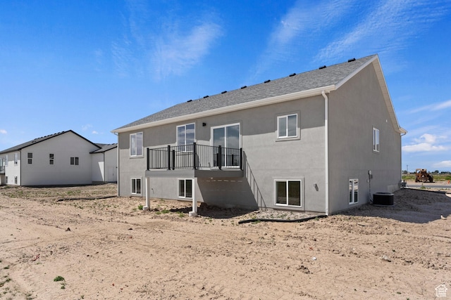 rear view of property with stucco siding