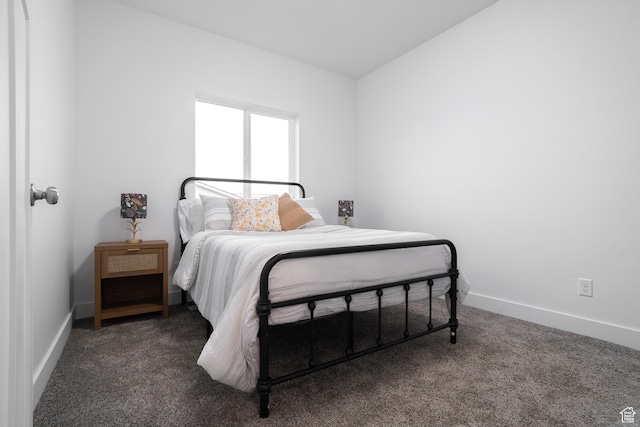 carpeted bedroom featuring baseboards
