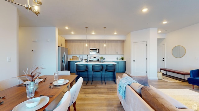dining area featuring light wood-type flooring
