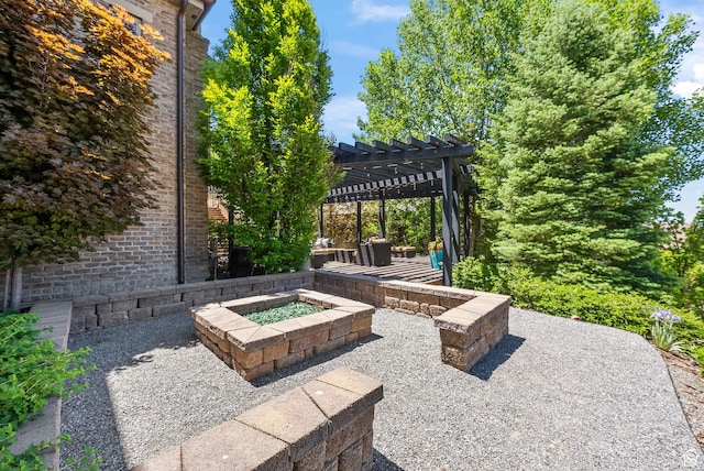 14234 S Canyon Vine Cv E, Draper, UT 84020 - view of patio featuring a pergola and a fire pit