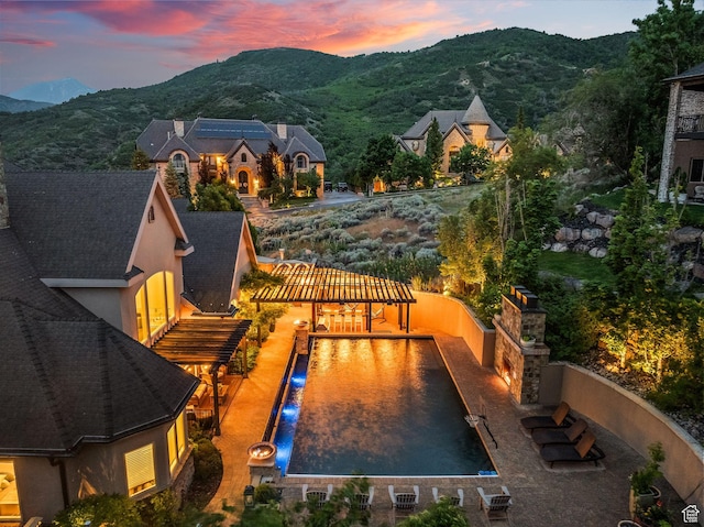 14234 S Canyon Vine Cv E, Draper, UT 84020 - pool at dusk featuring a mountain view