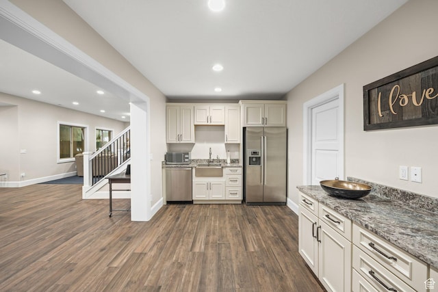 14234 S Canyon Vine Cv E, Draper, UT 84020 - kitchen featuring sink, dark wood-type flooring, stone countertops, and appliances with stainless steel finishes