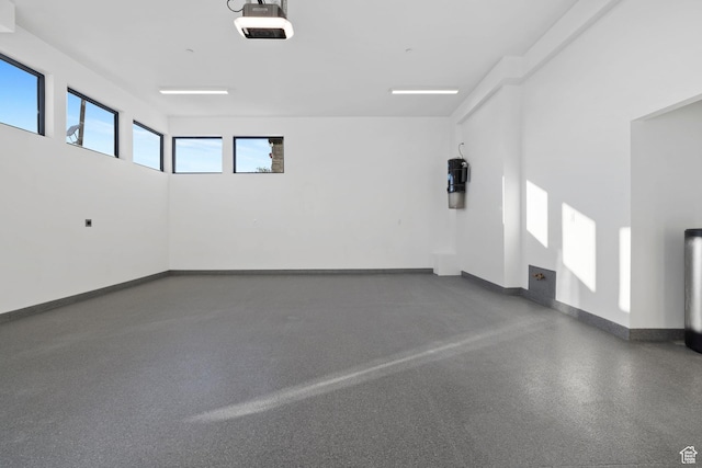 940 S N View Cir Unit 12, Woodland Hills, UT 84653 - garage featuring a central vacuum unit and a garage door opener