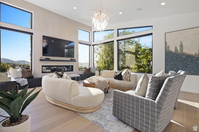 940 S N View Cir Unit 12, Woodland Hills, UT 84653 - living room featuring a notable chandelier and light wood-type flooring