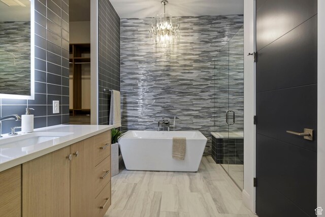 940 S N View Cir Unit 12, Woodland Hills, UT 84653 - full bathroom featuring tile walls, vanity, a freestanding tub, a chandelier, and a shower stall