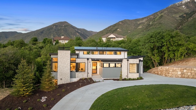 940 S N View Cir Unit 12, Woodland Hills, UT 84653 - back of house with a lawn, a mountain view, and a garage