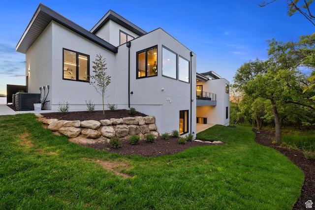 940 S N View Cir Unit 12, Woodland Hills, UT 84653 - rear view of property featuring a balcony, a yard, and central AC