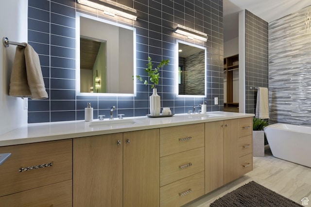 940 S N View Cir Unit 12, Woodland Hills, UT 84653 - bathroom featuring vanity, tasteful backsplash, tile walls, and a tub