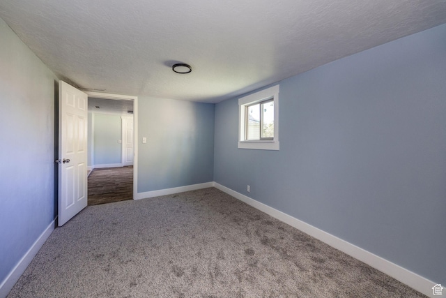 1090 S 2400 W, Lewiston, UT 84320 - empty room with baseboards, carpet floors, and a textured ceiling