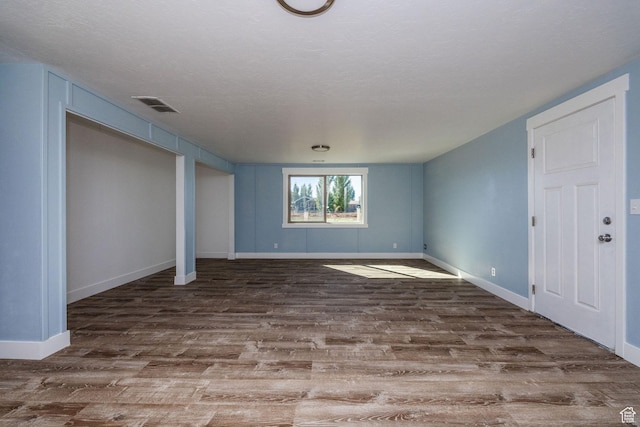 1090 S 2400 W, Lewiston, UT 84320 - interior space featuring wood finished floors, a textured ceiling, baseboards, and visible vents