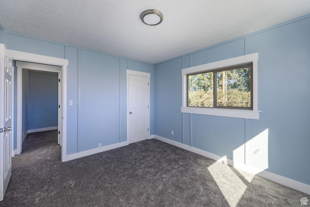 1090 S 2400 W, Lewiston, UT 84320 - unfurnished bedroom with baseboards, a closet, and carpet floors