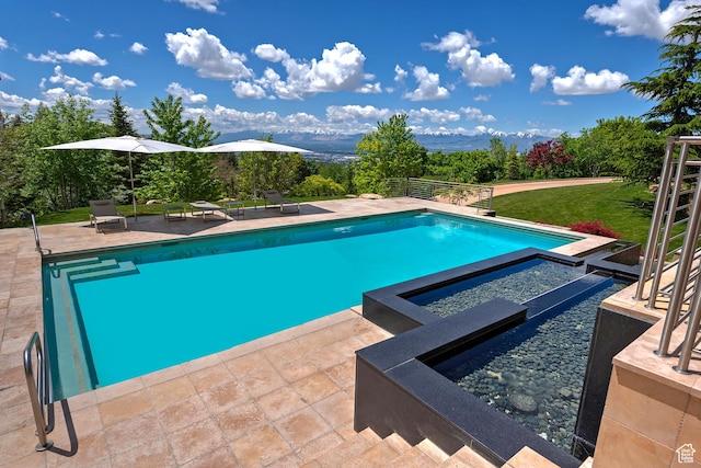 1559 E Tomahawk Dr N, Salt Lake City, UT 84103 - view of pool featuring a patio, a lawn, and an in ground hot tub