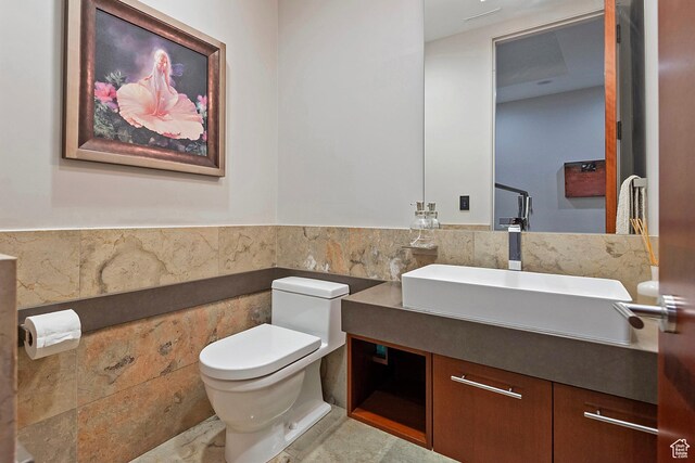 1559 E Tomahawk Dr N, Salt Lake City, UT 84103 - bathroom with tile walls, vanity, and toilet