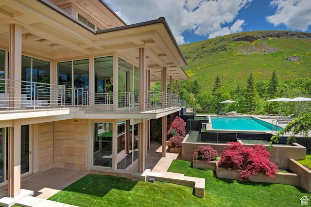 1559 E Tomahawk Dr N, Salt Lake City, UT 84103 - back of property featuring a patio area