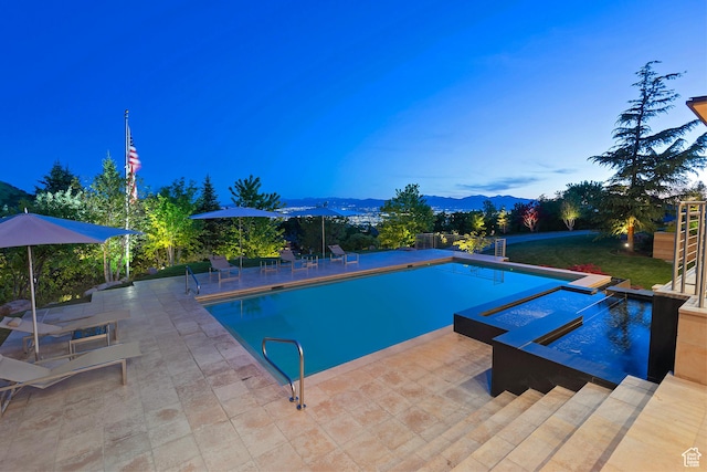 1559 E Tomahawk Dr N, Salt Lake City, UT 84103 - view of swimming pool with an in ground hot tub, a mountain view, and a patio