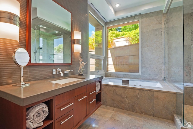 1559 E Tomahawk Dr N, Salt Lake City, UT 84103 - bathroom with plus walk in shower, backsplash, tile walls, and vanity