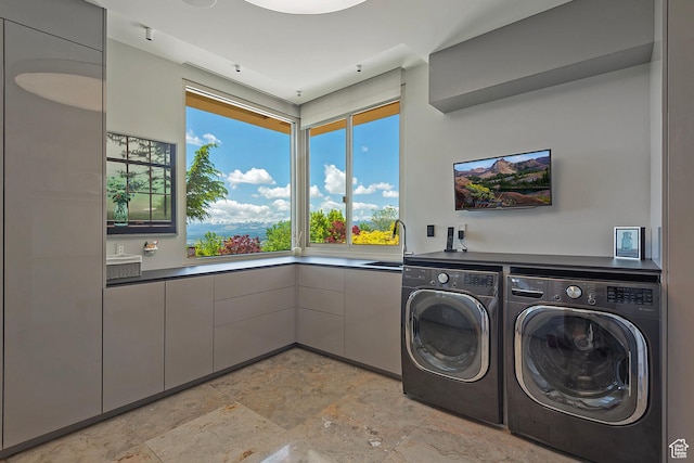 1559 E Tomahawk Dr N, Salt Lake City, UT 84103 - laundry room featuring sink, washer and clothes dryer, and cabinets