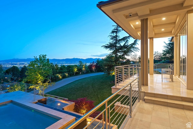 1559 E Tomahawk Dr N, Salt Lake City, UT 84103 - yard at dusk featuring a mountain view and a balcony