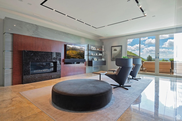 1559 E Tomahawk Dr N, Salt Lake City, UT 84103 - sitting room featuring a fireplace, french doors, and track lighting