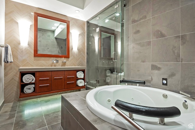 1559 E Tomahawk Dr N, Salt Lake City, UT 84103 - bathroom with tile patterned flooring, tile walls, plus walk in shower, and vanity