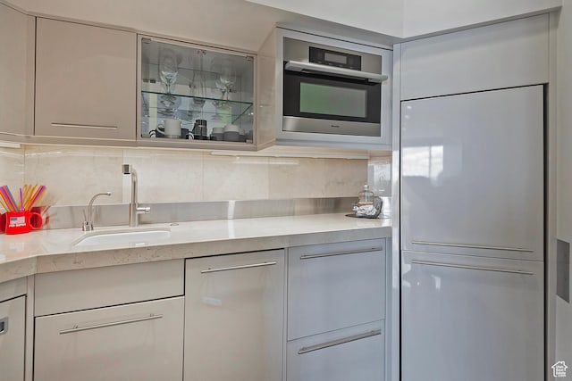 1559 E Tomahawk Dr N, Salt Lake City, UT 84103 - kitchen featuring sink, paneled built in refrigerator, and decorative backsplash