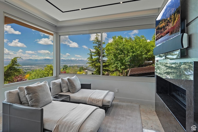 1559 E Tomahawk Dr N, Salt Lake City, UT 84103 - sunroom featuring a mountain view and a fireplace